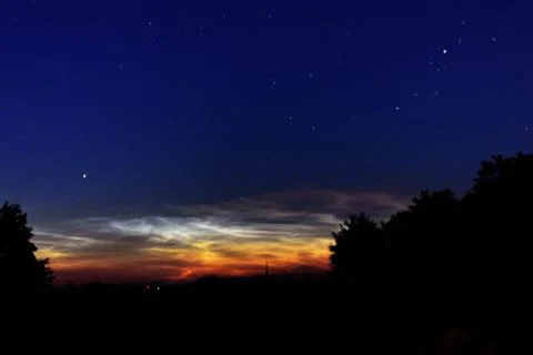 Silver clouds in the night sky Stock Photos