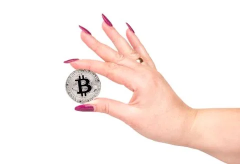 Silver coin bitcoin in hand Stock Photos