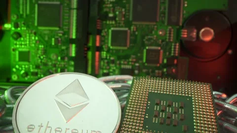 Silver coin Etherium and central processing unit in super macro shot. Slow Stock Footage 141377634