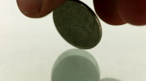 Silver coin spinning on white background Stock Footage 46663757