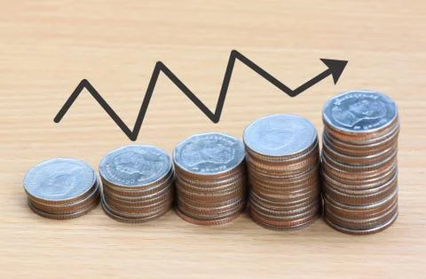 Silver coin stack and arrow line. 写真素材