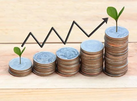 Silver coin stack and arrow line and have treetop. Stock Photos