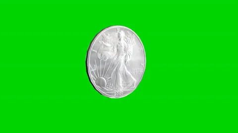 Silver coin turns - separated on green screen Stock Footage 33795872