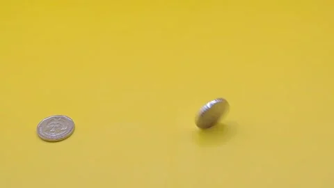 Silver coin on a yellow background Stock-Footage 333915124