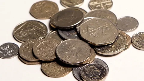Silver coins of different countries on the table Stock Footage 82485028