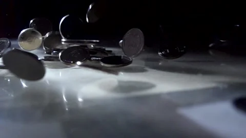 Silver coins fall on the table. Slow motion Stock Footage 151546441