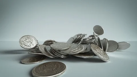 Silver Coins, Quarters Fall and Pile Up Stock Footage 77430349