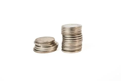 Silver coins stacked in minimalist composition Stock Photos