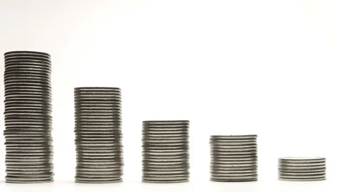Silver coins on stacks are decrease and increase on white background stop motion 库存影片 128310475