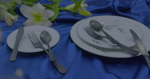 Silver color spoon and fork cutlery set on the table Stock Footage 260543565