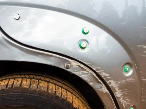 Silver colored car damaged Stock Photos