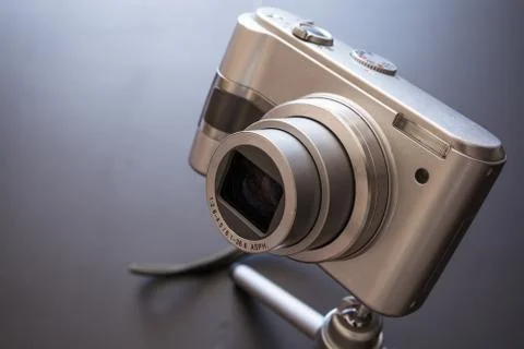 Silver compact digital photo camera. Stock Photos