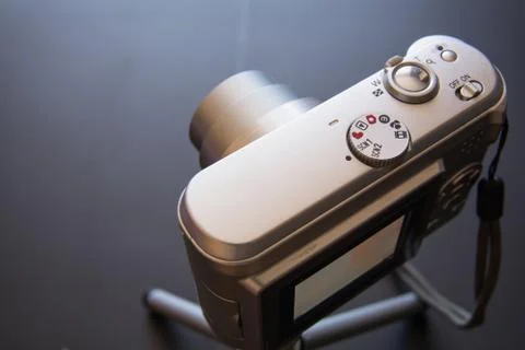 Silver compact digital photo camera. Stock Photos