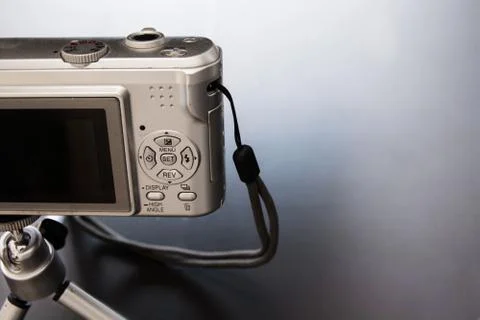 Silver compact digital photo camera. Stock Photos