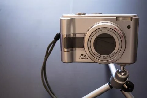 Silver compact digital photo camera. Stock Photos
