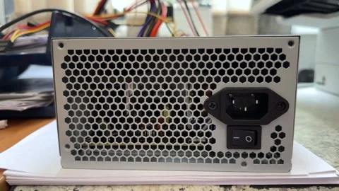 A silver computer power supply unit with a ventilation grille Stock Footage 341950610