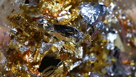 Silver, copper pieces of gold leaf extremely close-up, real time, glitter and pl Stock Footage 149219618