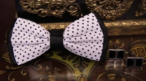 Silver cuff links and red bow tie Stock Footage 65549659