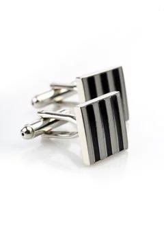 Silver cuff links on white background Stock Photos
