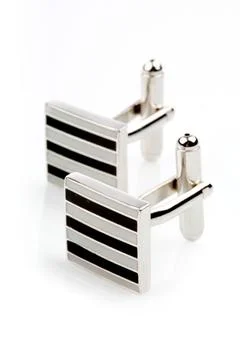 Silver cuff links on white background Stock Photos