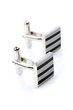 Silver cuff links on white background Stock Photos