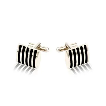Silver cuff links on white Foto stock