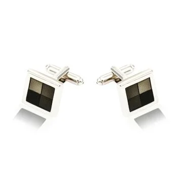 Silver cuff links on white Stock Photos