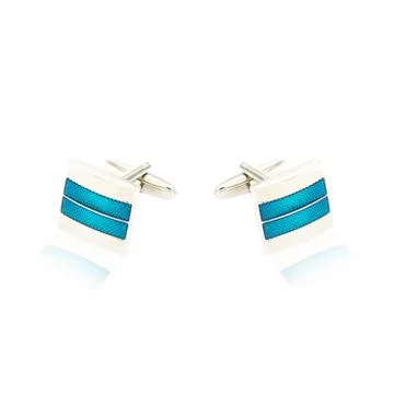 Silver cuff links on white Foto stock