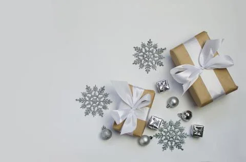 Silver decorations and present on a white background Stock Photos
