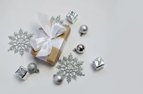 Silver decorations and present on a white background Stock Photos