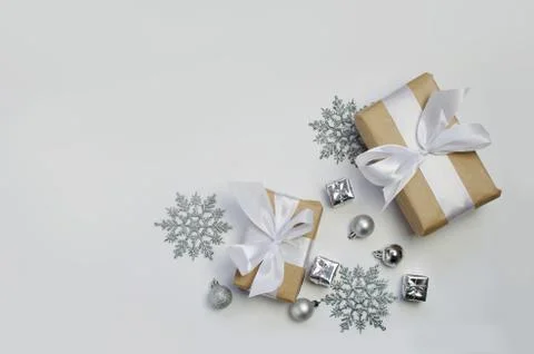 Silver decorations and present on a white background Stock Photos