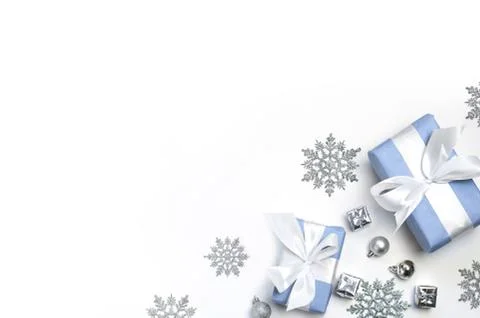 Silver decorations and present on a white background Stock Photos