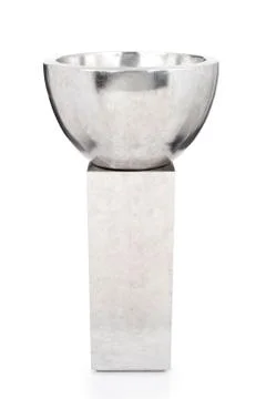 Silver Decorative Bowl on Golden Rectangular Pedestal Foto stock