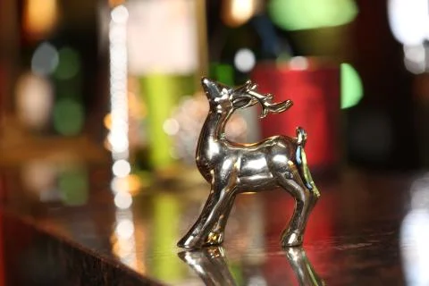 Silver deer on blurred background. Close up Stock Photos