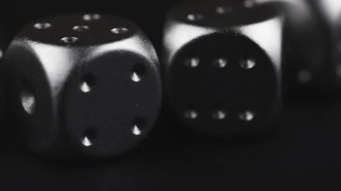 Silver dice close up on black background. Stock Footage 310677291