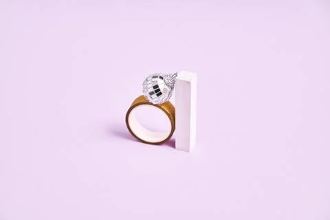 Silver disco ball , box, ring ang geometric shapes. 90s fashion. Engagement ring Stock Photos
