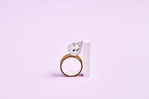 Silver disco ball , box, ring ang geometric shapes. 90s fashion. Engagement ring Stock Photos