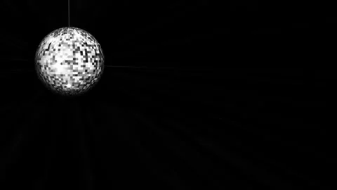A silver disco ball with rays of light on the left and a lot of free space on Stock Footage 294825395