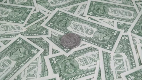 Silver Dollar Among One Dollar Bills. Video stock 320289410