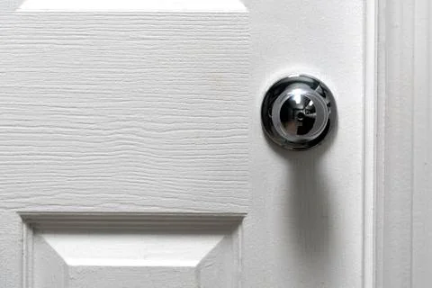 Silver Door Knob on white door , stainless steel round ball metallic door kno Stock Photos