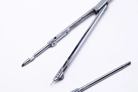 Silver Drawing Compass on White Background, Precision Instrument for Geomet.. Stock Photos