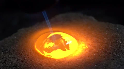 Silver drop melted with gas burner in jewelry workshop. Close up Stock Footage 145394607