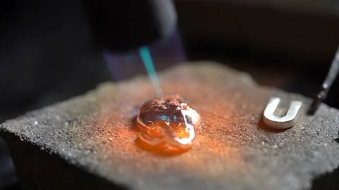 Silver drop melted with gas burner in jewelry workshop. Close up Stock Footage 145395009