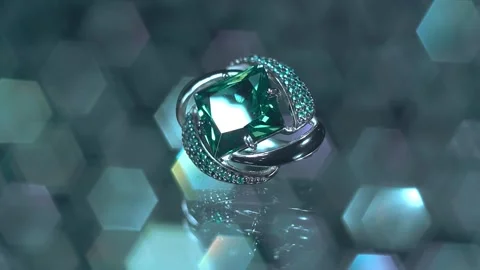 A silver earring with an emerald and a scattering of small precious stones  Stock Footage 259869527