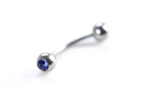Silver earring for piercing. Close up. Isolated on a white background Stock Photos