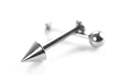 Silver earring for piercing. Close up. Isolated on a white background Foto stock