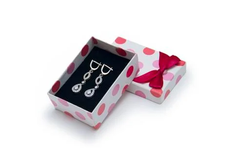 Silver earrings in a box on white background Stock Photos