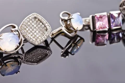 Silver earrings of different shapes Stock Photos