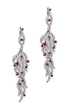 Silver earrings with ruby on white background Foto stock