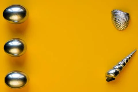 Silver eggs and shells on colored background 写真素材